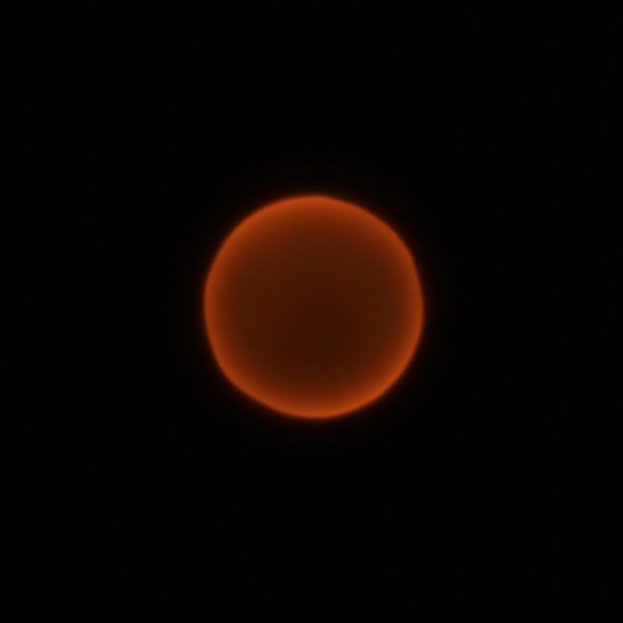 A warm abstract AI light orb in darkness